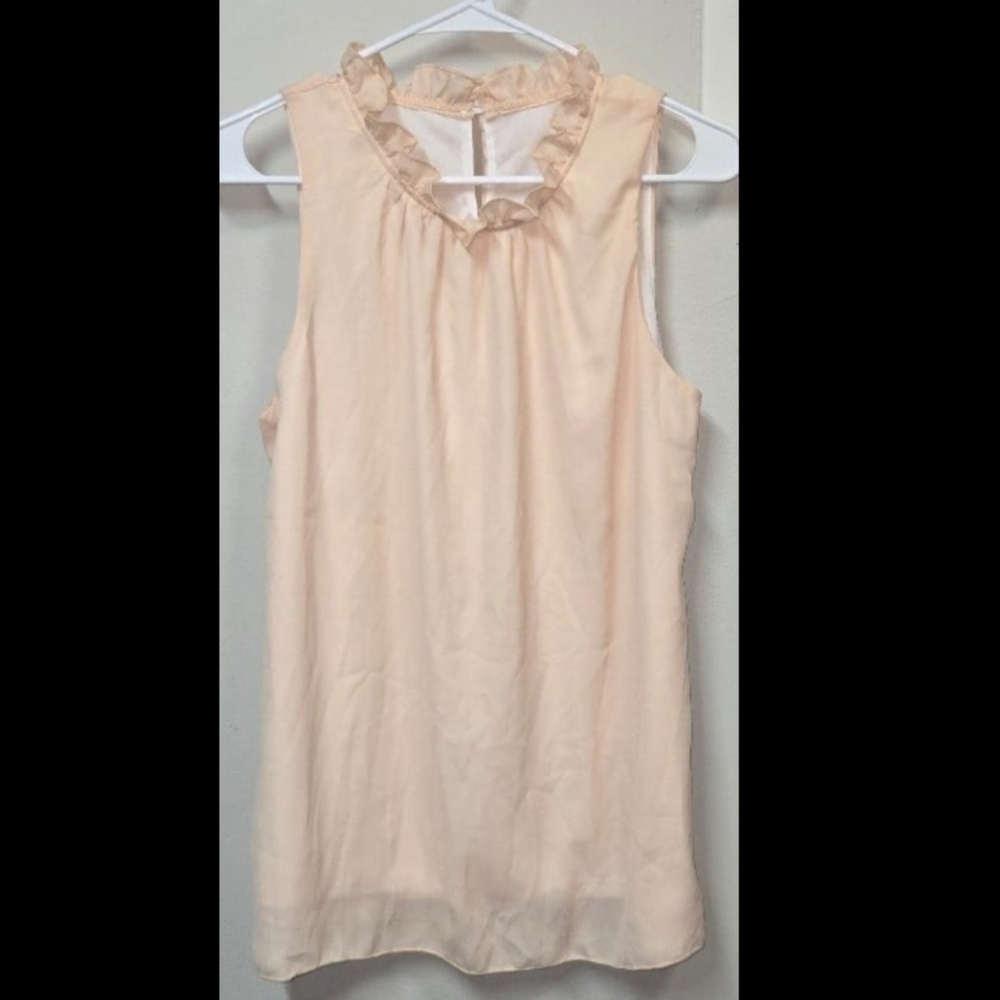 Sleeveless Peachy Cream Top With A Ruffle Neckline NWOT! Size Medium